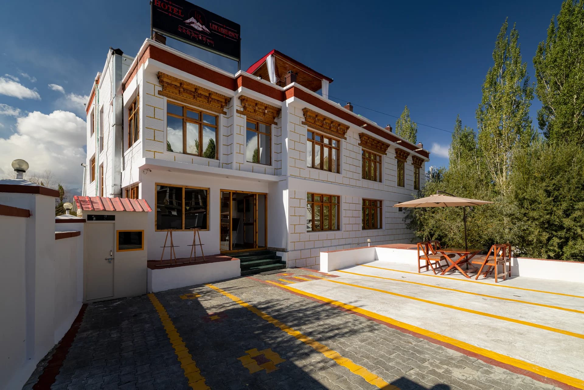 Traditional carved timber facade of Hotel Leh Residency
